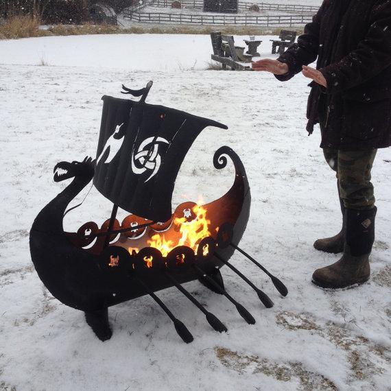 thinkgeek's tweet photo. Roast your s'mores like a true warrior. Viking Ship Fire Pit by Imagine Metal Art: http://t.co/TrUIlBchGG http://t.co/bnEOLjNxUp