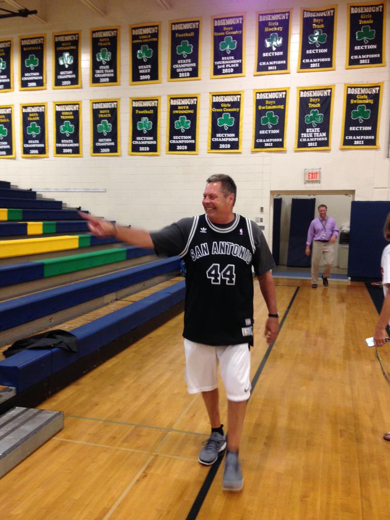 RosemountCC's tweet image. Congrats to Steve Bender as he walks to his retirement picture with his new George "Iceman" Gervin jersey.