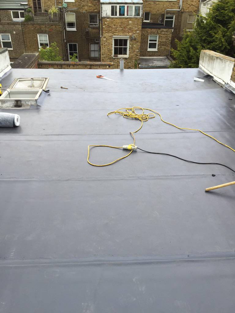 Overlaying the main roof on the Chelsea town house with Wolfin single ply. 👌