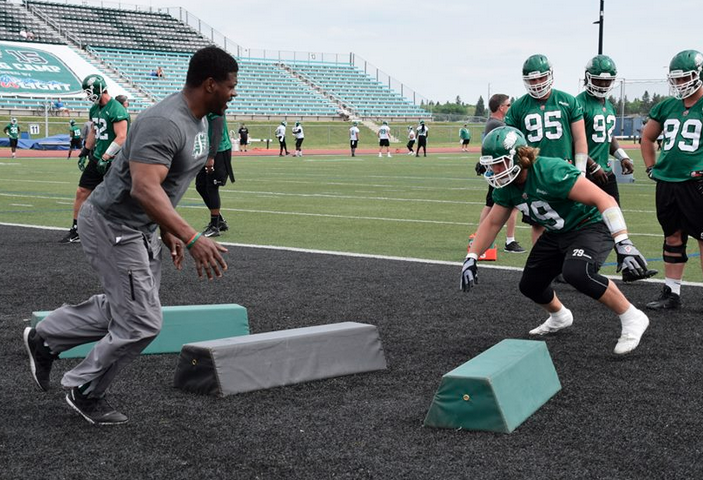sskroughriders's tweet photo. Coach Sinclair working with Matt Kozun on some DL drills   #RidersTC15 http://t.co/MufAvoRkfn