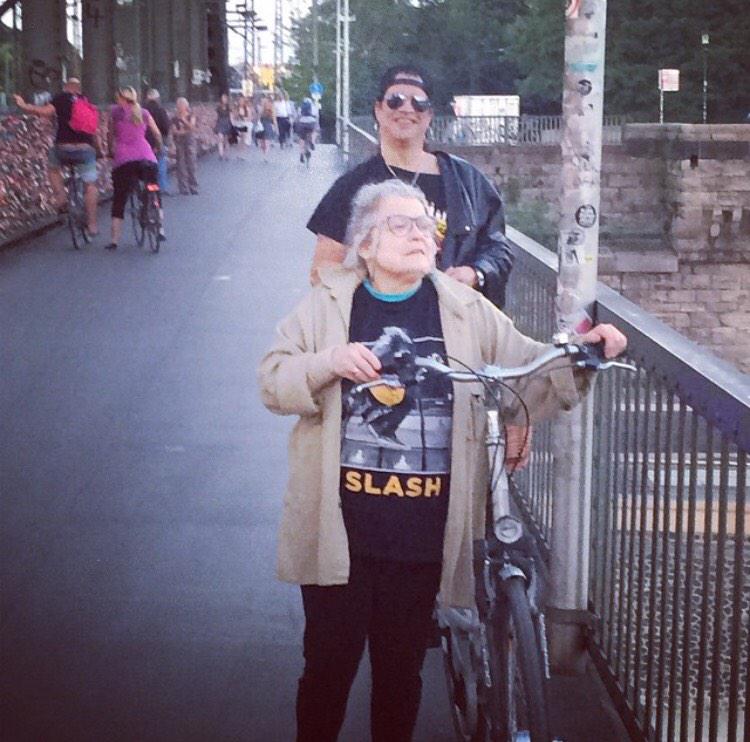 slashsydney's tweet photo. Slash photo bomb of Nana rockin @Slash shirt in Germany. Thanks @KnightMeegan http://t.co/zaxS474I4Z