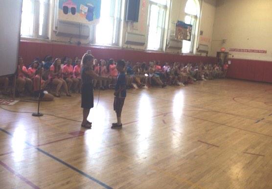 HochhauserM's tweet photo. Marvin receives his award for 2nd place in precision throw. Empire games. Students cheer- way to go@MineolaMS1 http://t.co/xKYC8Lvekf