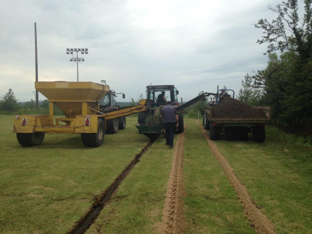 hylandturfcare's tweet photo. Installing secondary drainage with a @SheltonDrainage Whiz-wheel trencher for @annaduffgaa. http://t.co/TYskZQ5J1r