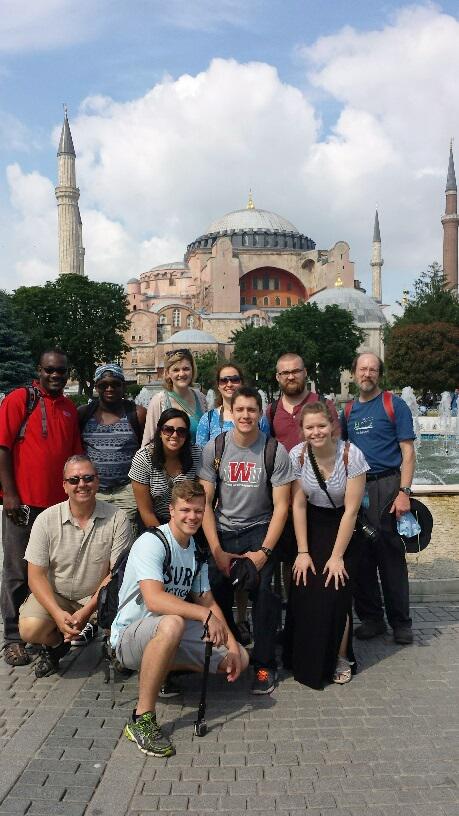 iwustm's tweet image. Drs. Joseph, Horst and Eby with IWU students at the Blue Mosque and Hagia Sophia in Istanbul.