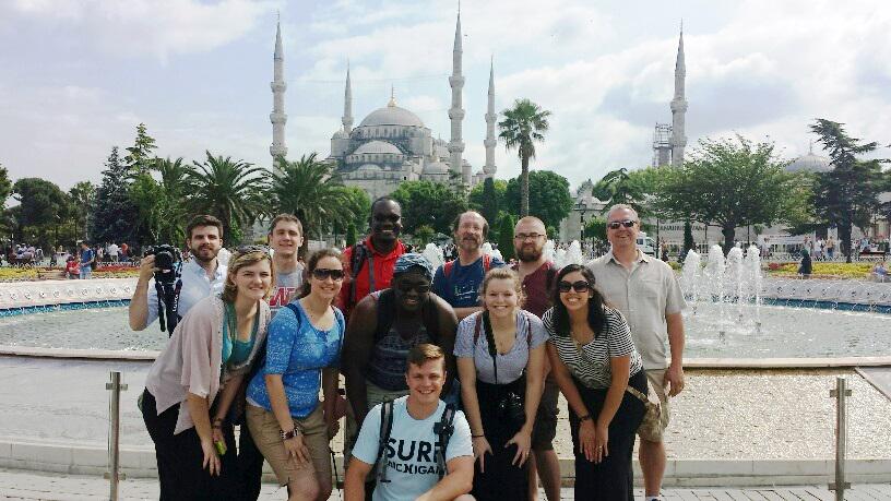 iwustm's tweet image. Drs. Joseph, Horst and Eby with IWU students at the Blue Mosque and Hagia Sophia in Istanbul.