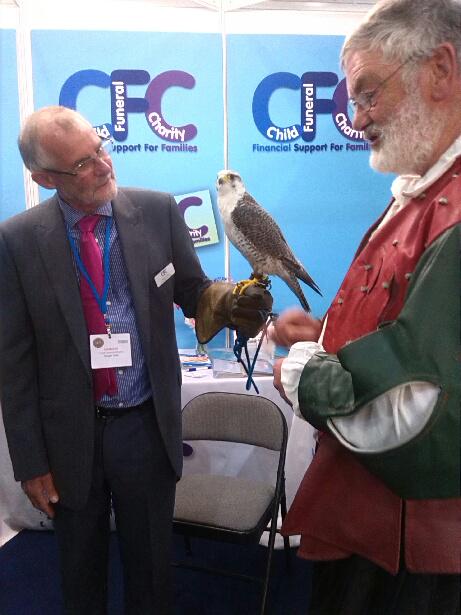 ChildFuneralUK's tweet photo. Our CEO with a bird on his arm at the NFE - Hall 2 Stand 403 - do come and say hello. http://t.co/NIphD4Lcfb