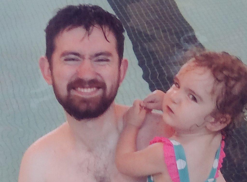 Babies first time swimming with <a href="/d_m_bronson/">David Bronson</a>. Kilo is holding her nose and kicking with great trepidation.