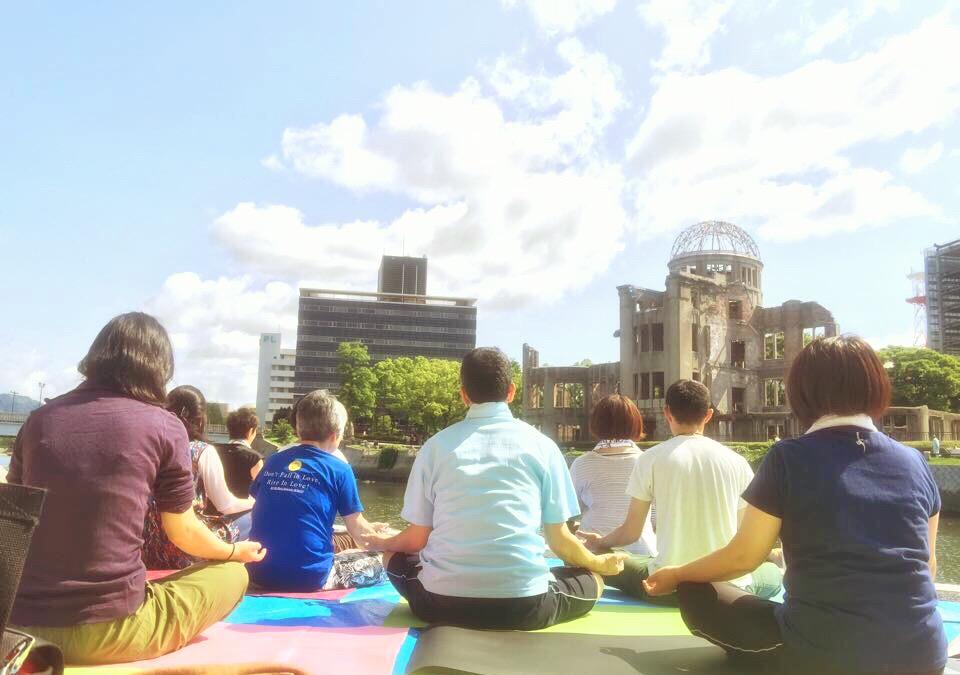 AOLSwamiji's tweet photo. #InternationalDayofYoga in front of Hiroshima Atomic bomb dome by @ArtOfLivingJP ! #YogaNewDimension @SriSri @secgen http://t.co/LfkKWWobjs