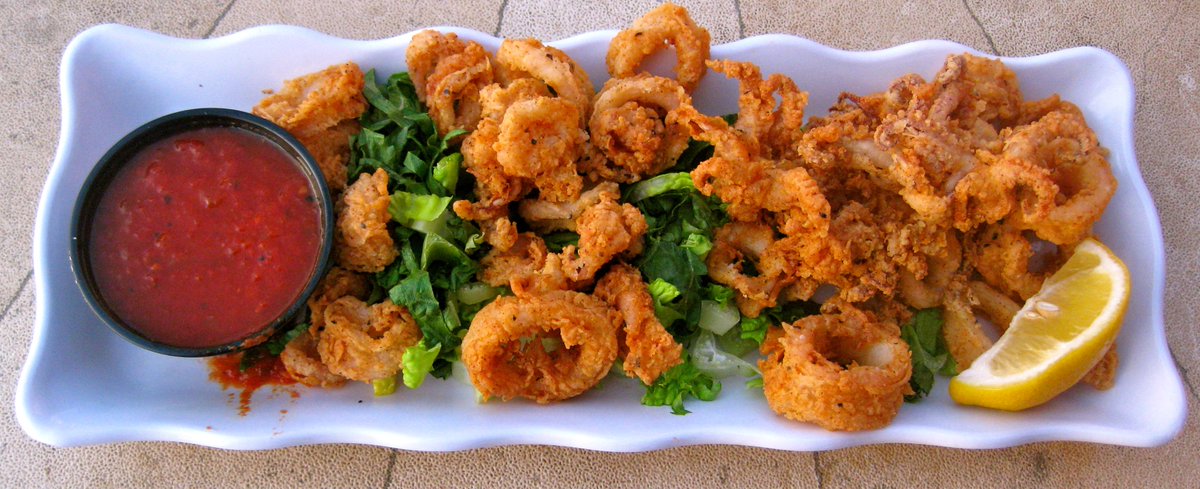 FRIED CALAMARI – Tender Calamari, lightly breaded and fried. Served with a homemade spicy marinara...
