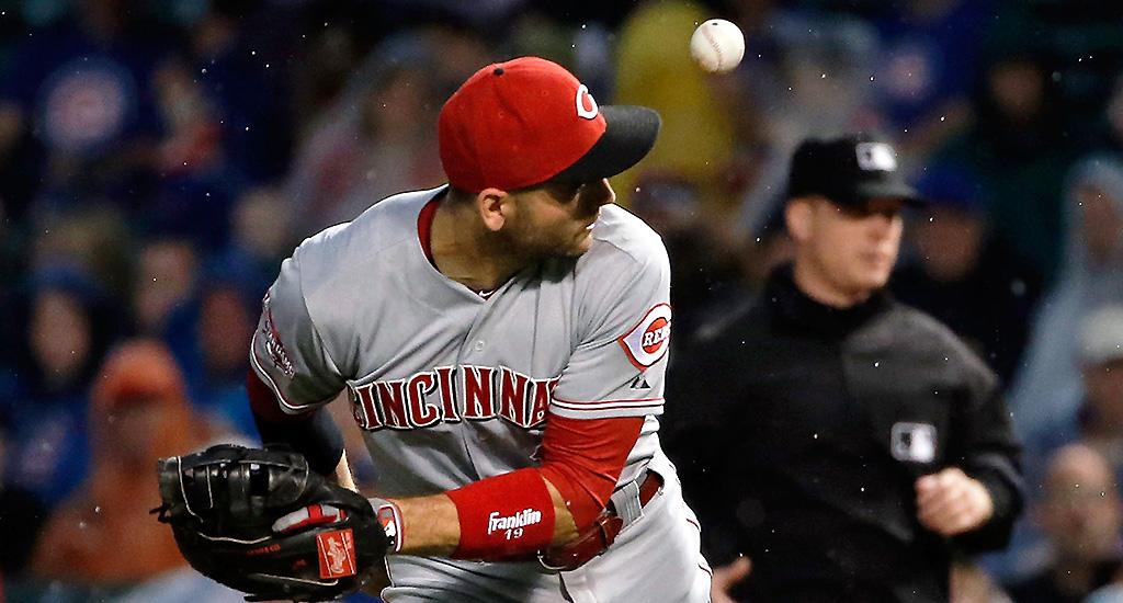 MLB's tweet photo. Why yes, that IS Joey Votto flipping one behind his back to the pitcher for the out: http://t.co/xbXxNNtb8r #MustC http://t.co/JhKZih7JdV