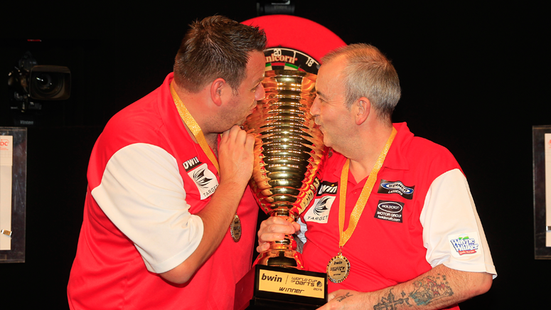OfficialPDC's tweet photo. Your 2015 @bwin World Cup of Darts winners, England...@PhilTaylor and @jackpot180! #bwinWCOD http://t.co/NMdiUu4oP4