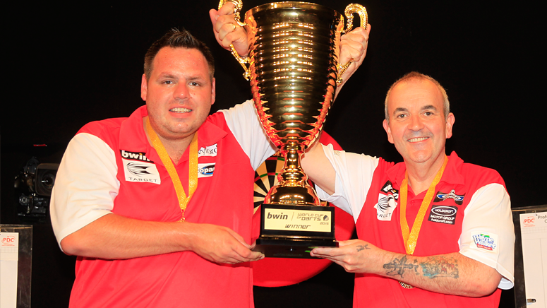 OfficialPDC's tweet photo. Your 2015 @bwin World Cup of Darts winners, England...@PhilTaylor and @jackpot180! #bwinWCOD http://t.co/NMdiUu4oP4