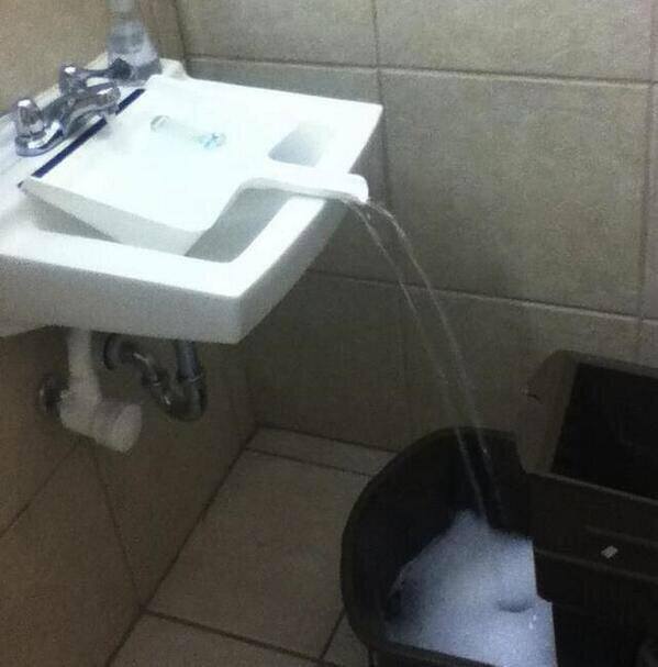 Use a dustpan to fill a container that doesn't fit in the sink