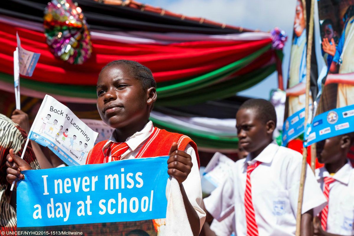 UNICEF's tweet photo. #PhotoOfTheWeek: Students carry banners &amp; flags promoting #education in #SouthSudan http://t.co/BNF6uR5eEO