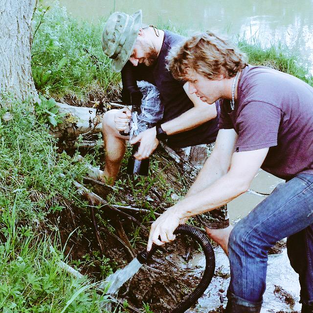 edgefactor_'s tweet photo. On set for our upcoming film: mud rushing down a river... Feat @dwdrums, @neilpeartnews, @TaylorGuitars, @CodyLovaas http://t.co/muFDO0YOsY