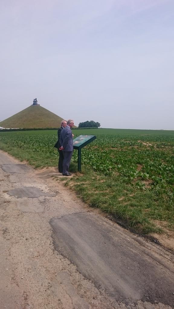 ClarenceHouse's tweet photo. The Prince of Wales and The Duke of Wellington view a #Waterloo200 memorial in front of Lion's Mound http://t.co/N6I0cD484q