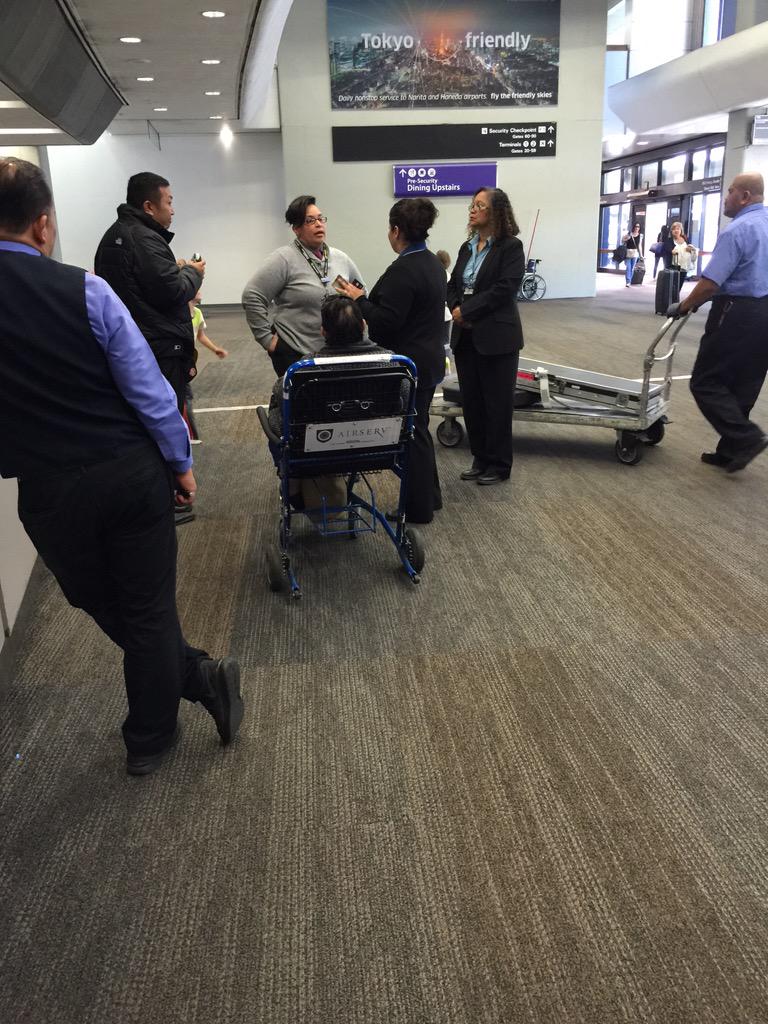 NilsEr's tweet photo. 8 @united attendants in "deep" discussion at SFO and not one will take our checked bag. http://t.co/PTTMH7TqYC