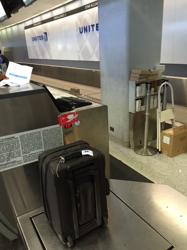 NilsEr's tweet photo. 8 @united attendants in "deep" discussion at SFO and not one will take our checked bag. http://t.co/PTTMH7TqYC
