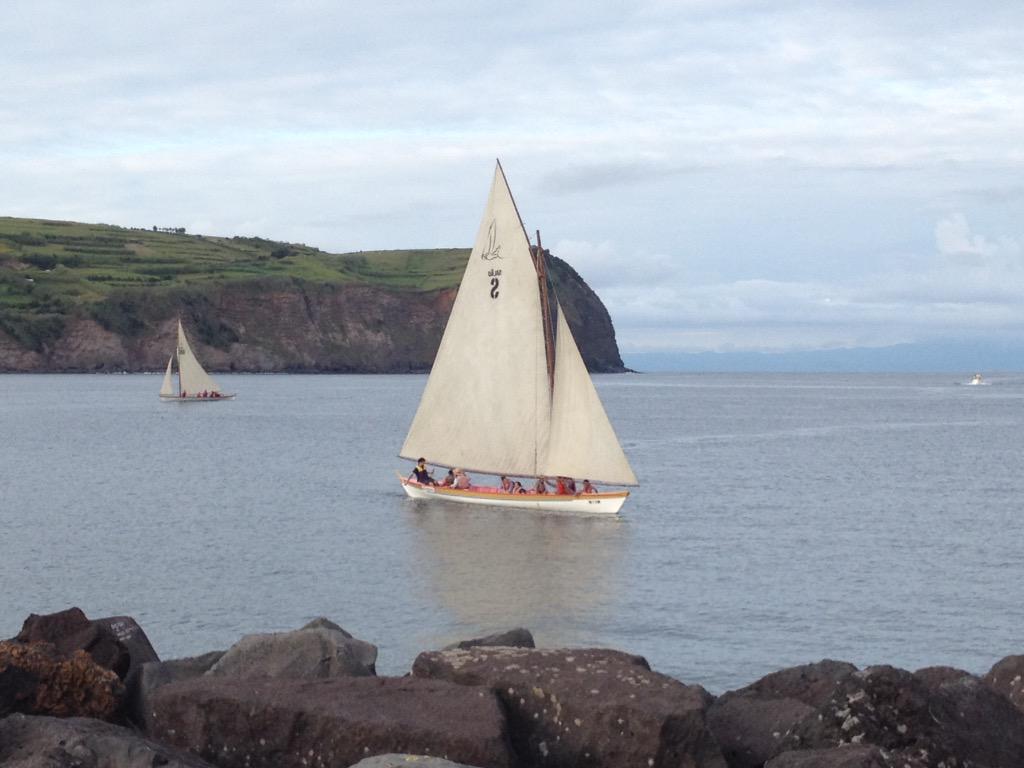 DistantShoresTV's tweet photo. Local boat race in Horta tonight including restored whaling canoes under sail. Beautiful. @FaialAzores #horta http://t.co/byf8mAxFia