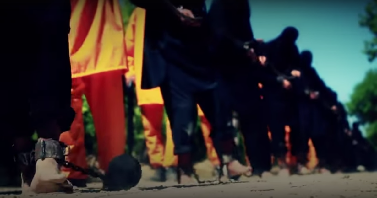 VICENews's tweet photo. Grisly video purportedly shows execution of 18 Islamic State militants: http://t.co/9vLLUZEpwF http://t.co/i2XkfUpIUU