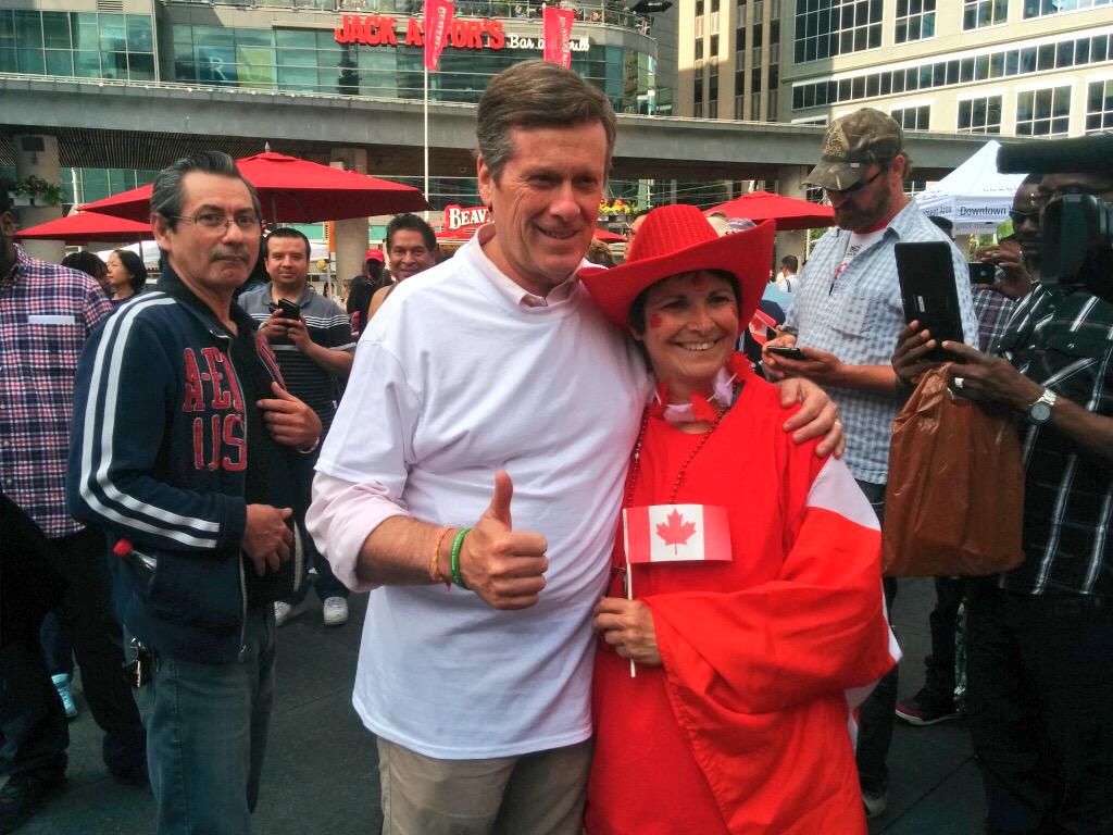 JohnTory's tweet photo. Forming a human Canadian flag at #CanadaDay celebrations at @YongeDundasSq downtown #TOpoli #canada148 http://t.co/asm9jl9n38