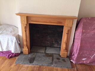 dean forge 5w wood burning stove with brick chamber, slate slips, stone hearth and using customers own pine surround.