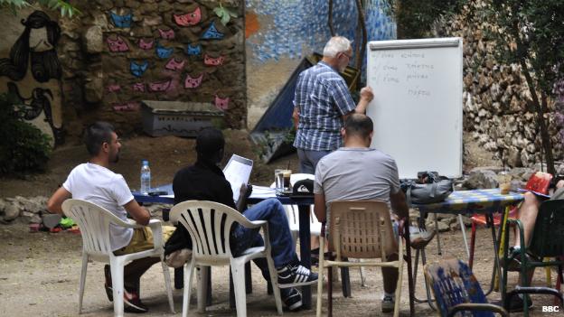 How migrants in Greece are being helped to feel part of the community. Listen: bbc.in/1NAaHRg