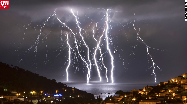 CNN's tweet image. July is the most dangerous month for lightning strikes. Here's how to stay safe: cnn.it/1JBZWN0