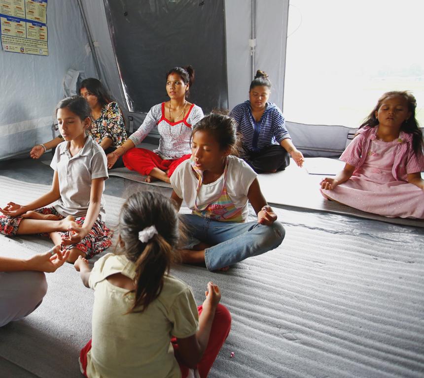 UNFPANepal's tweet image. A Yoga class for earthquake survivors at one of our female-friendly spaces in Kathmandu. #YogaDay #NepalQuake