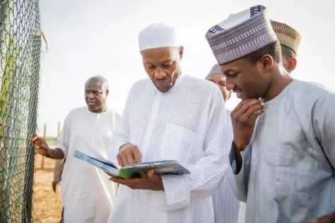 presidentngr's tweet photo. His Excellency,visit his Farm in Daura,Katsina State with his son Yusuf http://t.co/ysARfbImeU