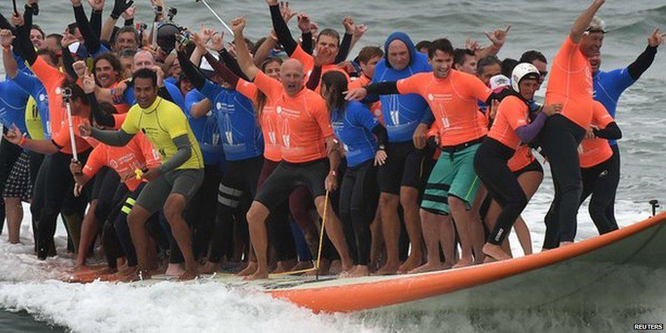 66 people on one surfboard - it's a new world record 🏄 bbc.in/1IsoiWw