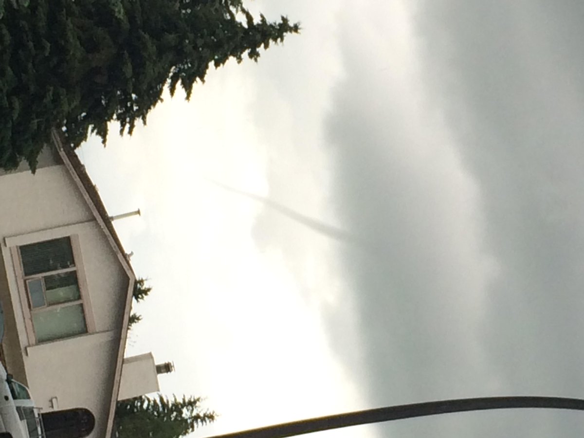 sarahoffin's tweet image. Multiple pictures of this #funnelcloud coming in to @GlobalCalgary seen in NE #yyc