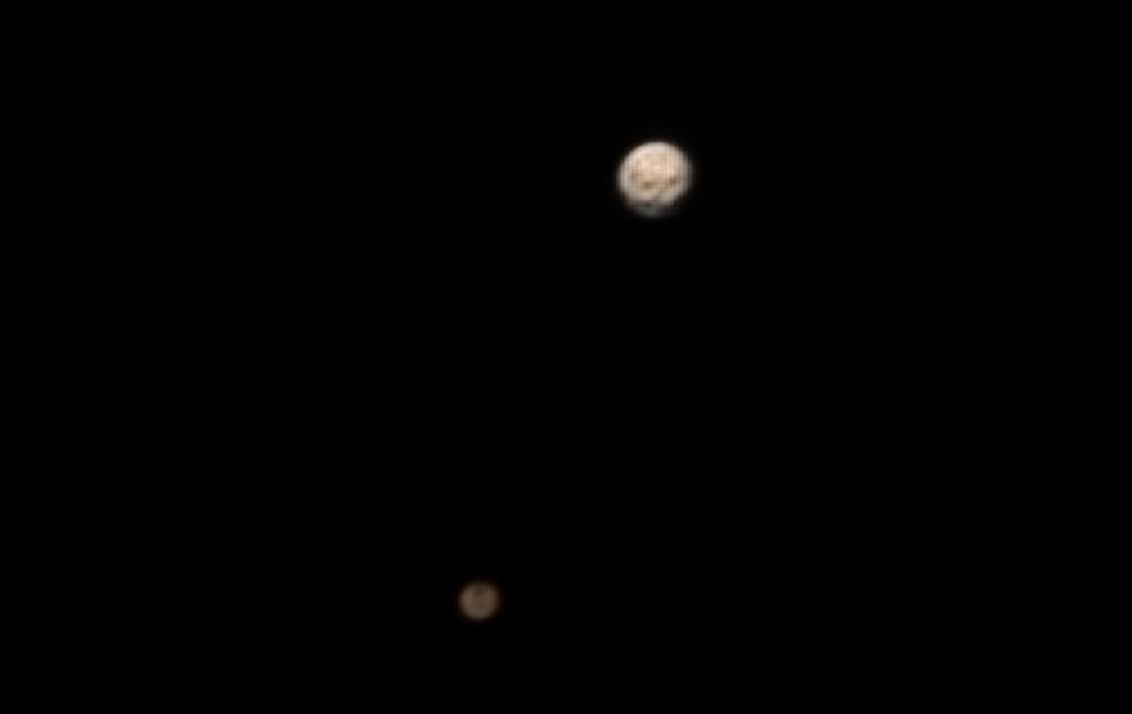 paulsanderson's tweet photo. From @AlanStern: Pluto and Charon in colour. Still getting closer... http://t.co/QwkR0Hp5vW http://t.co/sljAkKO3gK