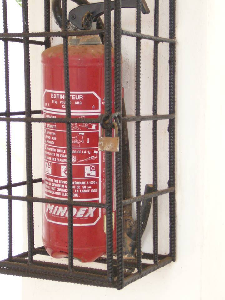 Only in Tanzania do you find a Fire Extinguisher with a lock on it so people won't steal it lol.In case of fire, Run