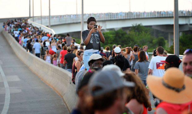 nycjim's tweet image. After 9 are killed in church massacre, #Charleston responds with a march for peace. postandcourier.com/article/201506…