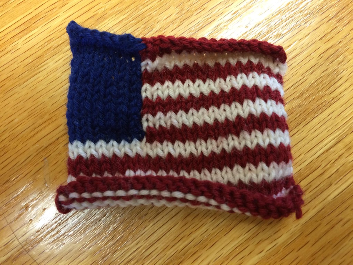 We knitted this flag with our Wayfarer yarn in Cranberry Harvest, Briny Deep and Natural colors!