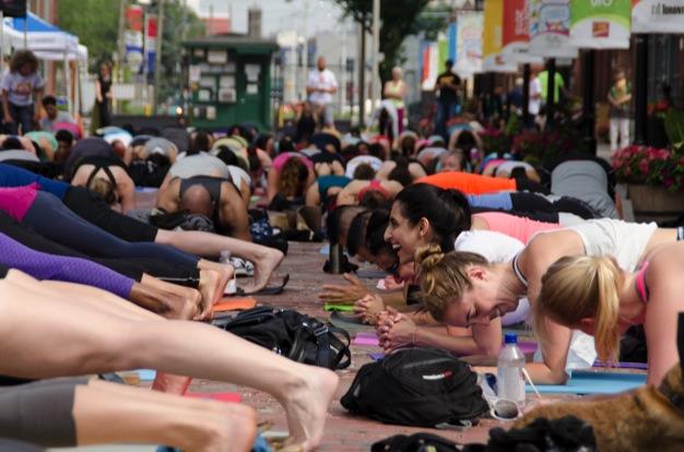 nowtoronto's tweet photo. Hundreds of happy babies stretch it out at the 3rd annual #OmTO2015 http://t.co/lSXAAXZHyg #YogaDay2015 http://t.co/9Gs0mlISGn