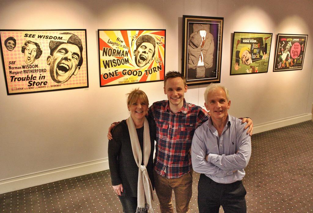 WisdomFoolPlay's tweet photo. Actor and writer Jack Lane with Nicholas & Jaqui Wisdom at his exhibition in February. #normanwisdom #wisdom100 http://t.co/Aa6OzzGCAi