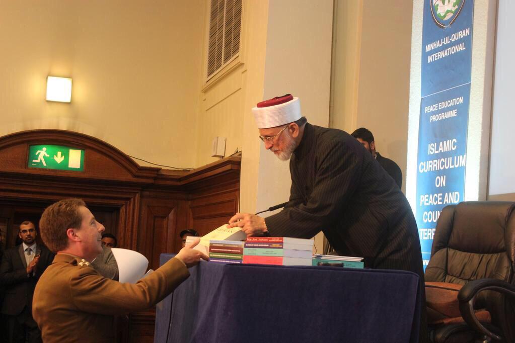 TahirulQadri's tweet photo. Handing a small gift to Brigadier Paul Harkness (Army Commander) after his speech at the counterterrorism curriculum http://t.co/Kb1K3eIMIo