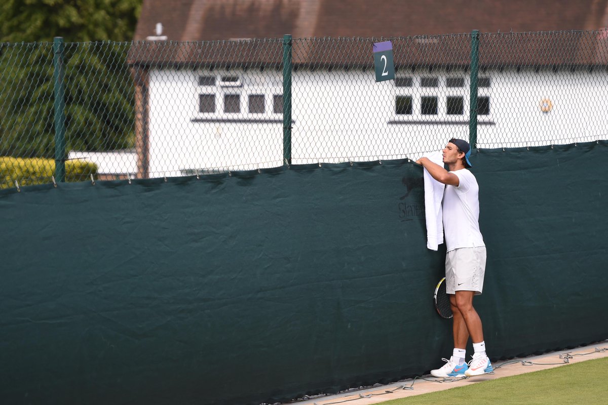 Wimbledon's tweet photo. Keeping an eye on the competition, Rafa? #WimbledonAwaits http://t.co/Ik8eTLk29V