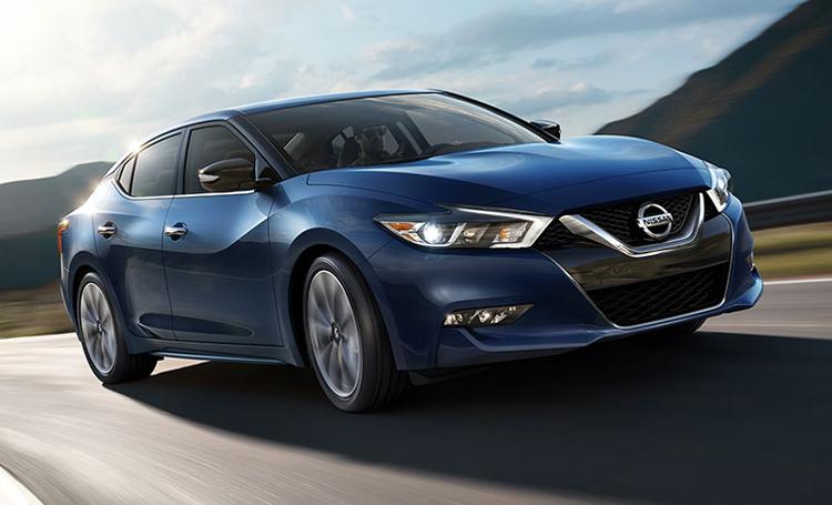NissanUSA's tweet photo. "If you’re looking to stand out on the road, this car delivers."  @Forbes  #2016Maxima review: http://t.co/Rw8CNY03Vn http://t.co/07am40rHdU