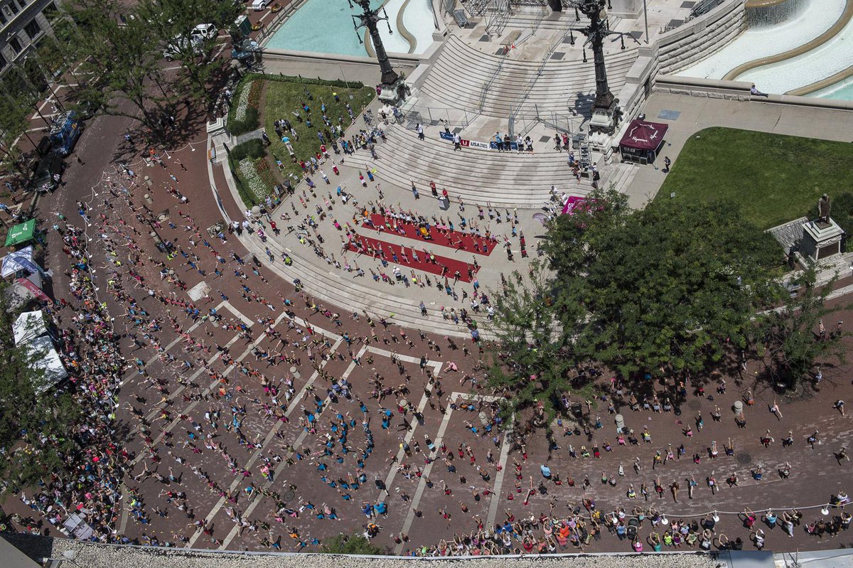 Great shots of Monument Circle for today's #OlympicDay celebration. Forming the rings &amp; doing handstands