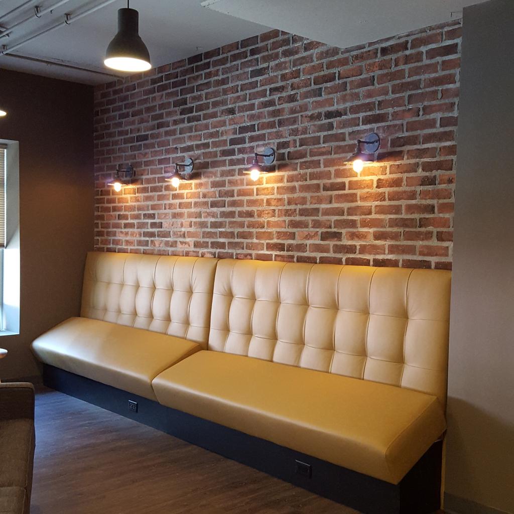 Custom banquet seat installation underway at our tech project booking.com #yaletown #cre #interiordesign