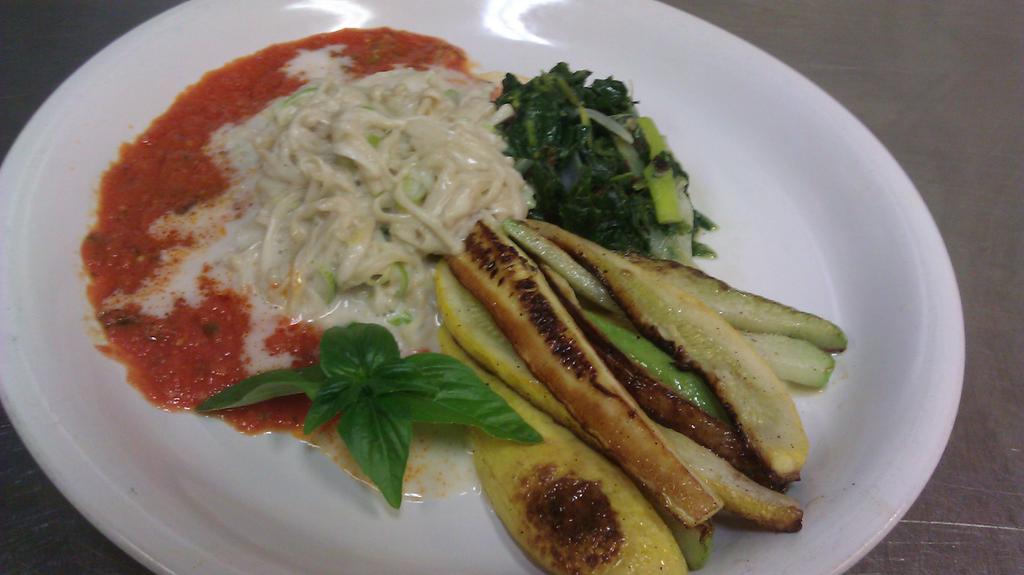 VEGAN coconut cremed Enoki Mushroom pasta in a Cherry tomato basil marinara charred chayote summer squash, poke salad