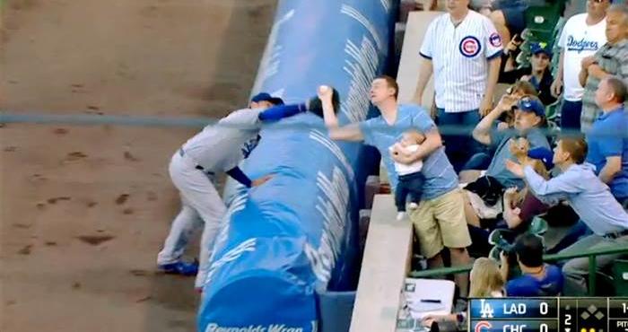 TODAYshow's tweet photo. The catch of the night at Tuesday's Chicago Cubs game belonged to a fan holding a baby: http://t.co/xng7Zy7WvG http://t.co/XySViuJS2X