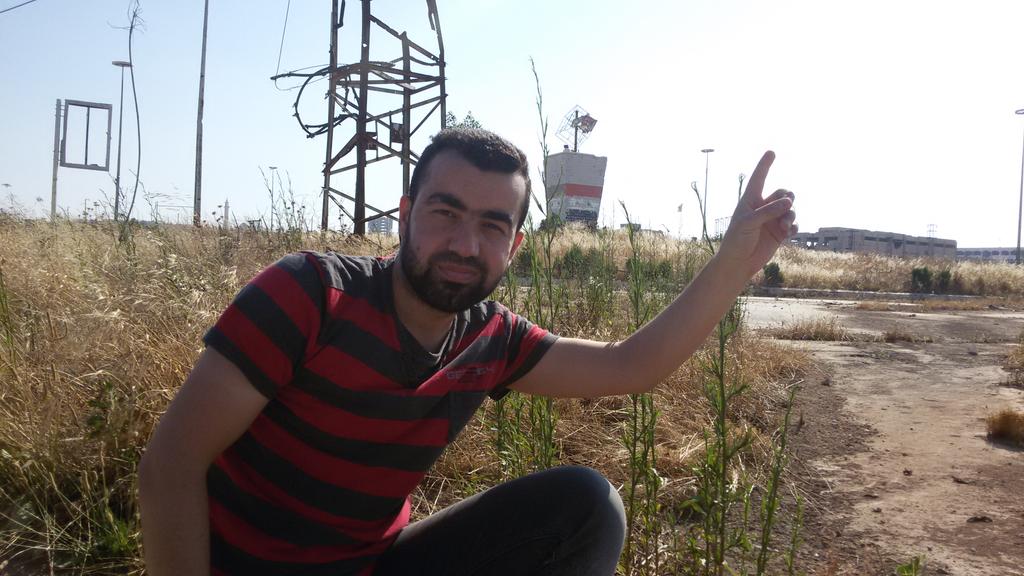 RamiSafadi93's tweet photo. @46Ahmedo indeed, here's a photo of activist, Abu Firas al-Halabi at the roundabout http://t.co/HR7YwePFAV