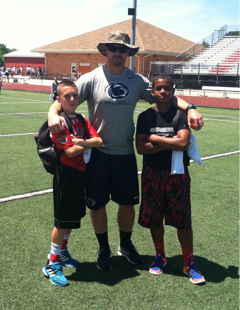 linganorefb's tweet photo. Good 3rd day at kids lhs football camp. Former Lancer Zach Zwinak with siblings of his HS teammates #RickyMJ http://t.co/YMHggM4pcs