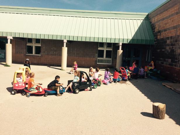 At the kindergarten car wash today in the St. Marguerite courtyard. Quite a line up!