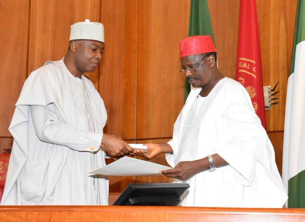 Senate President Bukola Saraki receiving credentials of RMK as he is sworn in as Sen representing kano Central.