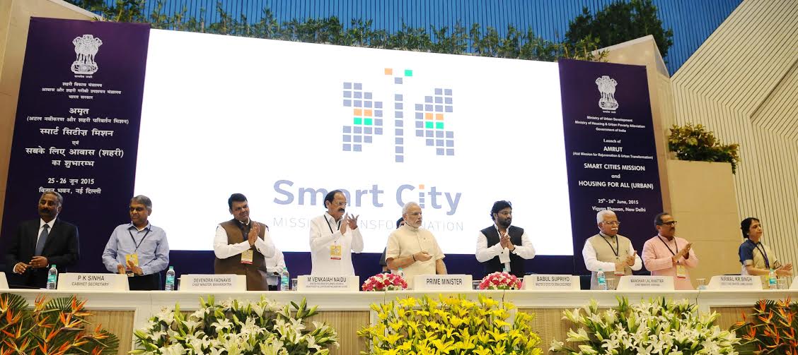 PIB_India's tweet photo. PM Shri @narendramodi unveiling the Logo of Smart Cities Mission at Vigyan Bhavan, New Delhi http://t.co/sETn5NOsvt